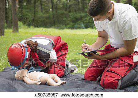 CPR training on baby dummy View Large Photo Image Stock Photo - CPR training on baby dummy. Fotosearch