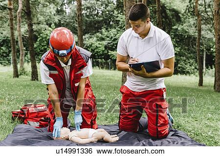 CPR training on baby dummy View Large Photo Image Stock Photograph - CPR training on baby dummy. Fotosearch