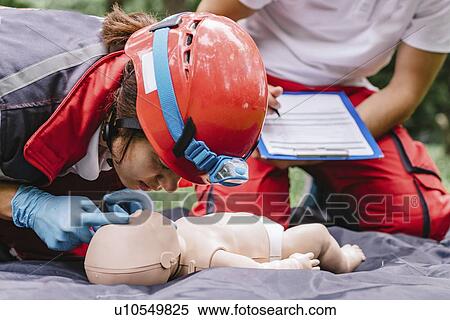 CPR training on baby dummy View Large Photo Image Stock Photography - CPR training on baby dummy. Fotosearch