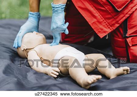 CPR training on baby dummy View Large Photo Image Stock Photography - CPR training on baby dummy. Fotosearch