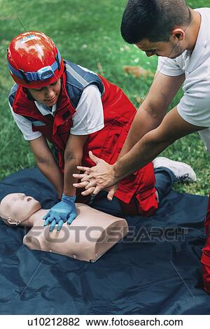 CPR training on dummy View Large Photo Image Stock Image - CPR training on dummy. Fotosearch