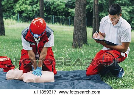 Stock Photo - CPR training on dummy. Fotosearch
