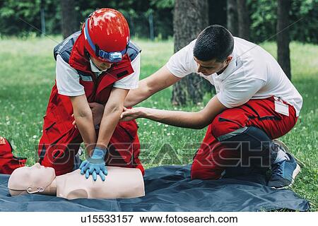 Stock Photo - CPR training on dummy. Fotosearch