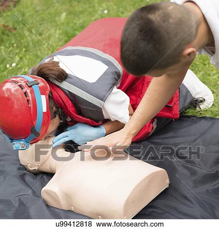 Stock Photo - CPR training on dummy. Fotosearch