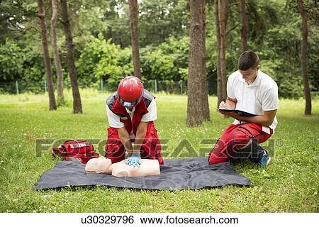CPR training on dummy View Large Photo Image Stock Photograph - CPR training on dummy. Fotosearch
