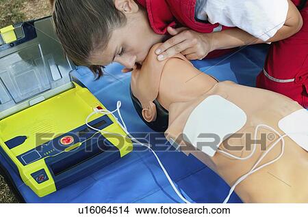 CPR training with defibrillator View Large Photo Image Picture - CPR training with defibrillator. Fotosearch