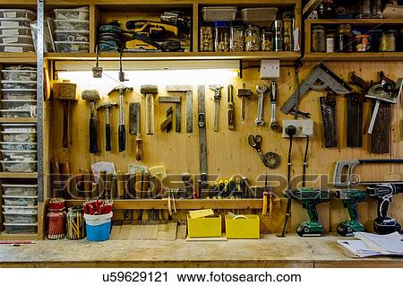 Stock Image - Craftsman's tools and workshop. Fotosearch