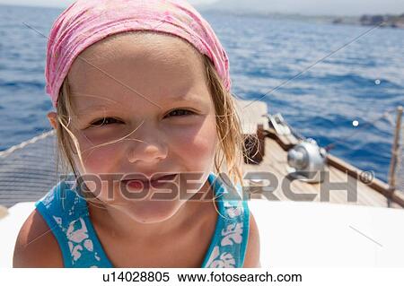 Cute girl on boat wearing headscarf, portrait, Castellammare del Golfo, Sicily, Italy View Large Photo Image Stock Photography - Cute girl on boat wearing headscarf, portrait, Castellammare del Golfo, Sicily, Italy. Fotosearch