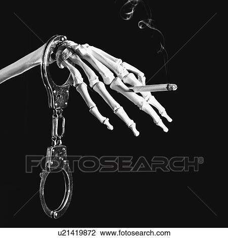 Stock Image - Deadly smoking addiction, conceptual image. Fotosearch