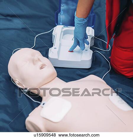 Stock Photo - Defibrillator training. Fotosearch