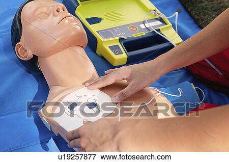 Stock Photo - Defibrillator training. Fotosearch