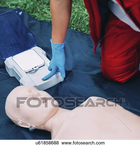 Stock Photo - Defibrillator training. Fotosearch