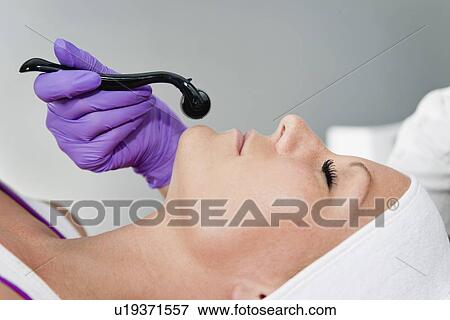 Stock Photo - Dermaroller treatment. Fotosearch