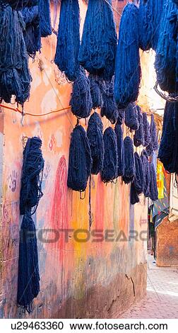Stock Image - Dyed cotton hung out to dry, Marrakech, Morocco. Fotosearch
