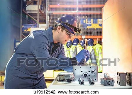 Engineer inspecting valves during outage in nuclear power station View Large Photo Image Stock Image - Engineer inspecting valves during outage in nuclear power station. Fotosearch