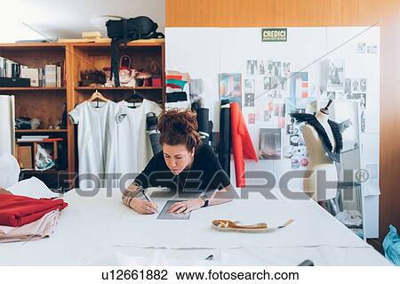 Fashion designer drawing and creating dressmaker's pattern View Large Photo Image Stock Image - Fashion designer drawing and creating dressmaker's pattern. Fotosearch