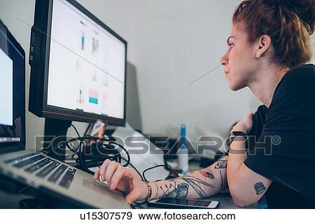 Fashion designer researching using digital tablet View Large Photo Image Stock Photo - Fashion designer researching using digital tablet. Fotosearch