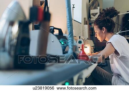 Fashion designer working at sewing machine View Large Photo Image Stock Photograph - Fashion designer working at sewing machine. Fotosearch