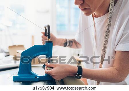 Picture - Fashion designer working in her studio. Fotosearch