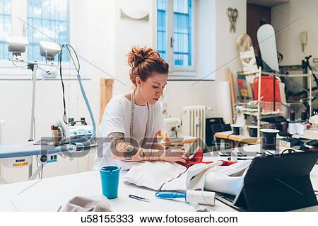 Fashion designer working in her studio View Large Photo Image Stock Image - Fashion designer working in her studio. Fotosearch