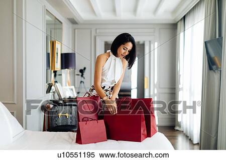 Fashionable woman with shopping bags in suite View Large Photo Image Stock Photography - Fashionable woman with shopping bags in suite. Fotosearch
