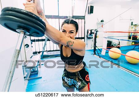 Female boxer lifting weights View Large Photo Image Stock Photo - Female boxer lifting weights. Fotosearch