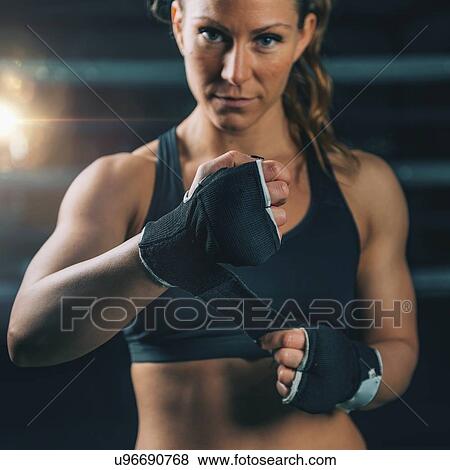 Female boxer wrapping hands View Large Photo Image Stock Photo - Female boxer wrapping hands. Fotosearch