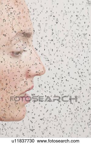 Stock Image - Female face with jumbled letters, conceptual image.. Fotosearch