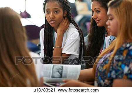 Female higher education students discussing project in college classroom View Large Photo Image Stock Image - Female higher education students discussing project in college classroom. Fotosearch