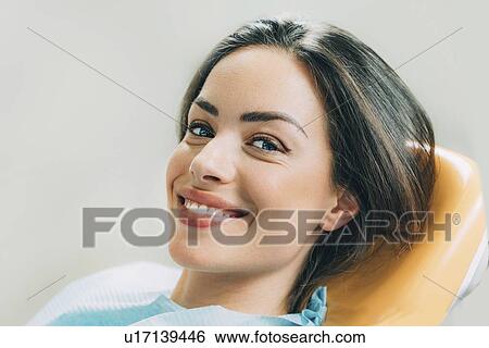 Female patient sitting in dentist's chair View Large Photo Image Stock Photograph - Female patient sitting in dentist's chair. Fotosearch