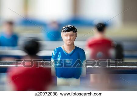 Stock Photo - Figure of footballer on table football. Fotosearch