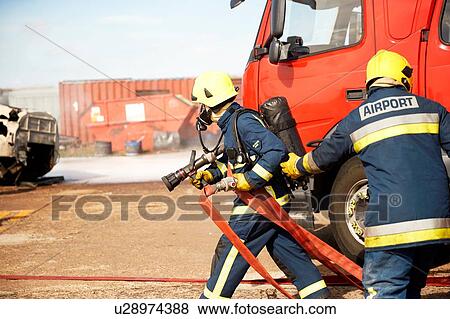 Firemen and fire engine in training centre, Darlington, UK View Large Photo Image Stock Photo - Firemen and fire engine in training centre, Darlington, UK. Fotosearch