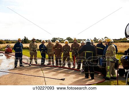 Firemen training, team of firemen listening to supervisor at training facility View Large Photo Image Stock Image - Firemen training, team of firemen listening to supervisor at training facility. Fotosearch