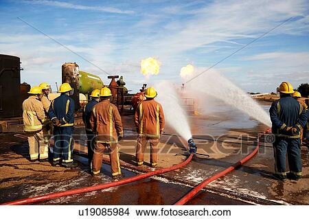 Firemen training to put out fire on burning tanks, Darlington, UK View Large Photo Image Picture - Firemen training to put out fire on burning tanks, Darlington, UK. Fotosearch