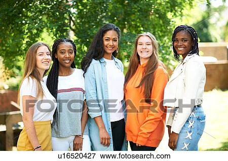 Stock Photo - Five young women, higher education students on college campus, portrait. Fotosearch