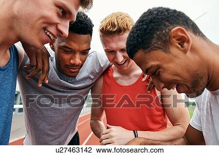 Friends talking on running track View Large Photo Image Stock Image - Friends talking on running track. Fotosearch