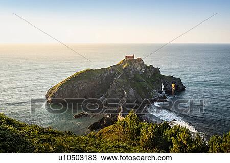 Stock Image - Gaztelugatxeko Doniene. Gaztelugatxe is an islet on the coast of Biscay, Bermeo, Basque Country, Spain. Fotosearch