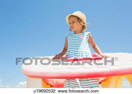 Girl in sun hat looking out from plastic roof on beach, Castellammare del Golfo, Sicily, Italy View Large Photo Image Stock Image - Girl in sun hat looking out from plastic roof on beach, Castellammare del Golfo, Sicily, Italy. Fotosearch