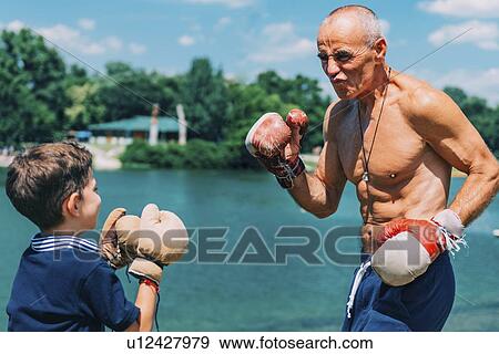 Grandfather and grandson boxing View Large Photo Image Stock Photo - Grandfather and grandson boxing. Fotosearch