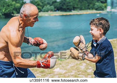 Grandfather and grandson boxing View Large Photo Image Stock Photograph - Grandfather and grandson boxing. Fotosearch
