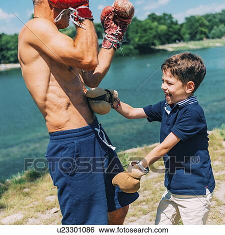 Grandfather and grandson boxing View Large Photo Image Stock Photograph - Grandfather and grandson boxing. Fotosearch