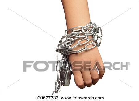 Stock Image - Hand with metal chains. Fotosearch