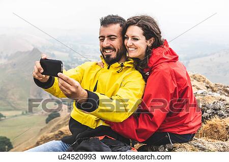 Hiker couple taking selfie, Chrome Hill, Peak District, Derbyshire View Large Photo Image Stock Image - Hiker couple taking selfie, Chrome Hill, Peak District, Derbyshire. Fotosearch