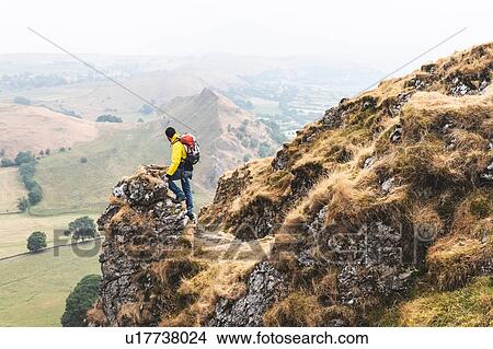 Hiker enjoying view from summit, Chrome Hill, Peak District, Derbyshire View Large Photo Image Picture - Hiker enjoying view from summit, Chrome Hill, Peak District, Derbyshire. Fotosearch