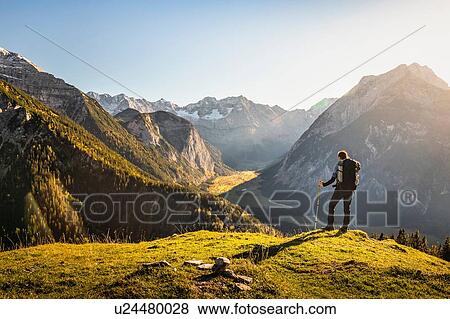 Stock Photo - Hiker enjoying view, Karwendel region, Hinterriss, Tirol, Austria. Fotosearch