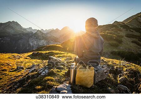 Stock Photo - Hiker enjoying view, Karwendel region, Hinterriss, Tirol, Austria. Fotosearch