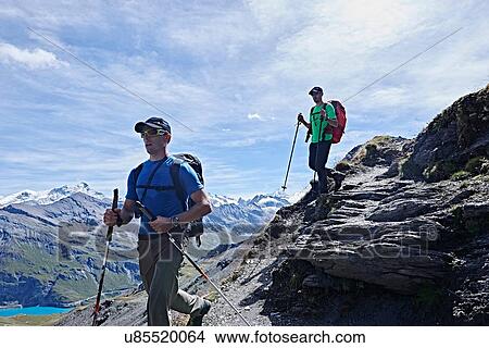 Picture - Hiker friends in Mont Cervin, Matterhorn, Valais, Switzerland. Fotosearch