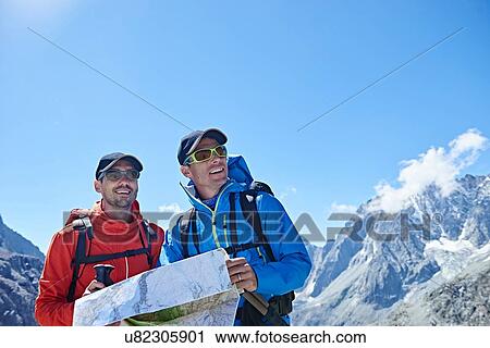 Hiker friends reading map, Mont Cervin, Matterhorn, Valais, Switzerland View Large Photo Image Stock Image - Hiker friends reading map, Mont Cervin, Matterhorn, Valais, Switzerland. Fotosearch