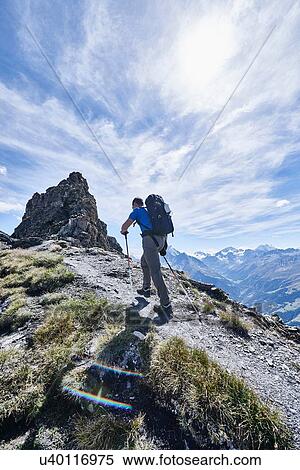 Stock Photography - Hiker in Mont Cervin, Matterhorn, Valais, Switzerland. Fotosearch