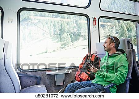 Stock Image - Hiker in train, Valais, Switzerland. Fotosearch